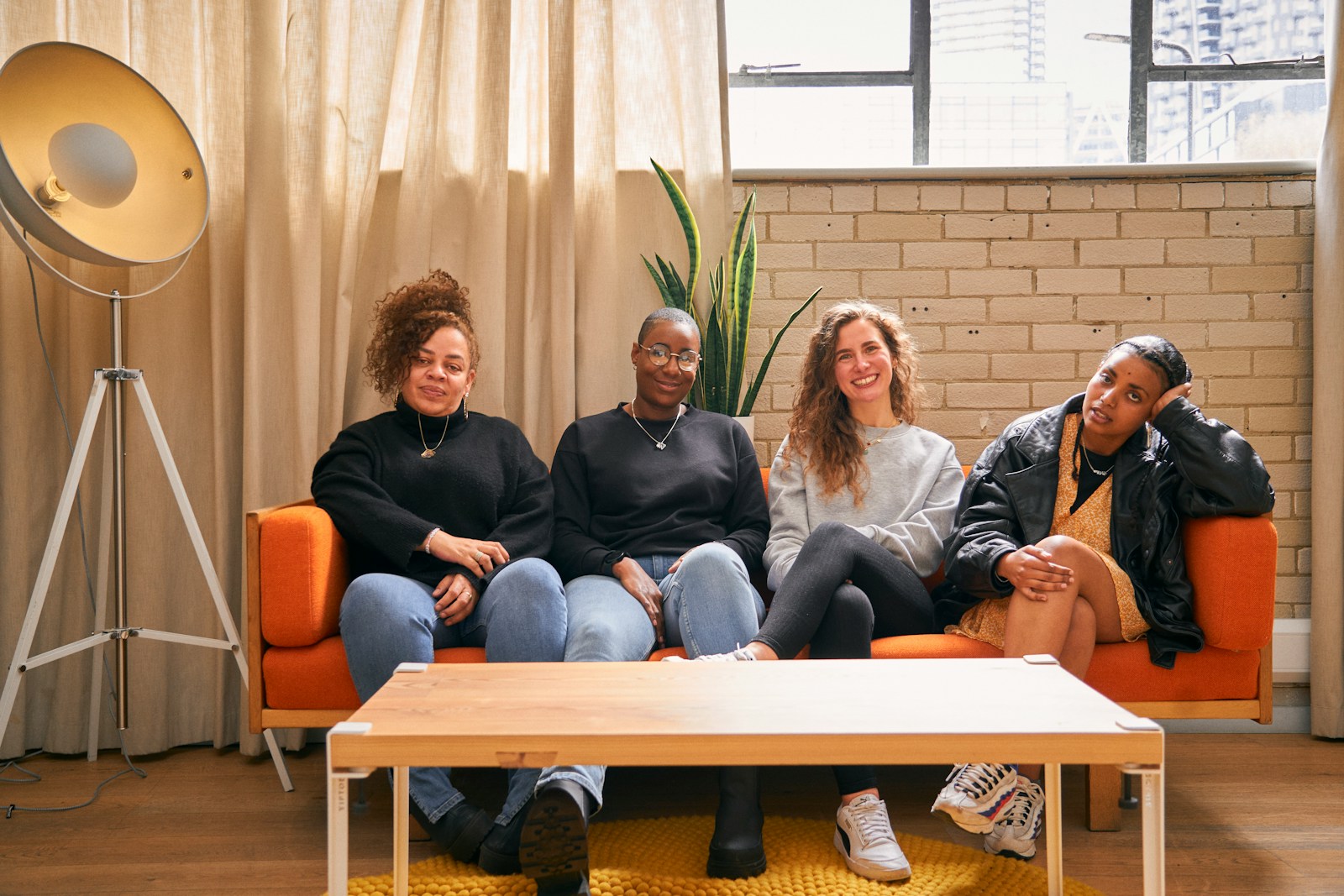 a group of people sitting on top of a couch